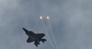 An F-35A Lightning II releases a flare while inverted over Hill Air Force Base during a demonstration practice Feb. 10, 2020, at Hill AFB, Utah