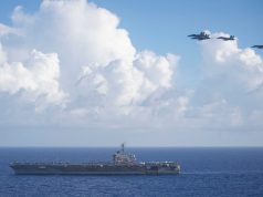 Super Hornets fly over USS Theodore Roosevelt