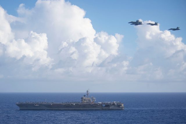 Super Hornets fly over USS Theodore Roosevelt