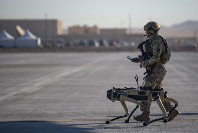 Airman with a Ghost Robotics Vision 60 robot dog