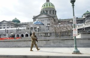 A soldier walks along his patrol at the capitol complex in Harrisburg, Pa., on Jan. 17, 2021.