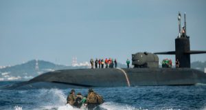 US Marines embarking Ohio-class submarine via raiding craft