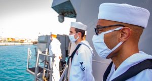 Sailors man the rails as the guided-missile destroyer USS Winston S. Churchill (DDG 81) arrived in Port Sudan, Sudan for a scheduled port visit