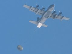 AFSOC MC-130J dropping palletized munitions