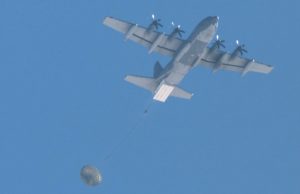 AFSOC MC-130J dropping palletized munitions