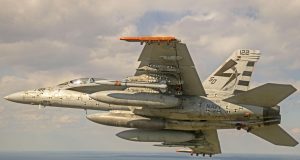 F/A-18 flies with an AARGM-ER missile