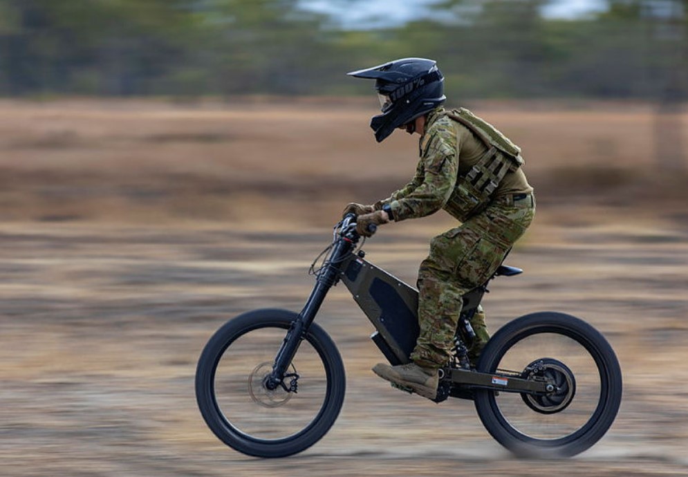 Australian Army soldiers riding a B-52 stealth e-bike