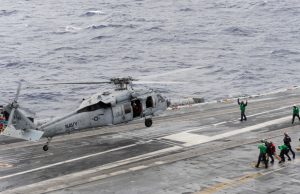 An MH-60S Sea Hawk helicopter assigned to the Chargers of Helicopter Sea Combat Squadron (HSC) 26 takes off from the flight deck of the aircraft carrier USS Theodore Roosevelt (CVN 71).