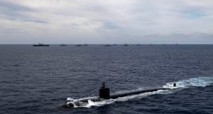 JMSDF submarine leads an international formation of ships during Annualex