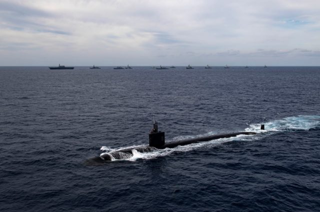 JMSDF submarine leads an international formation of ships during Annualex