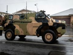 An Australian Army Bushmaster Protected Mobility Vehicle drives through the Windsor region in New South Wales.