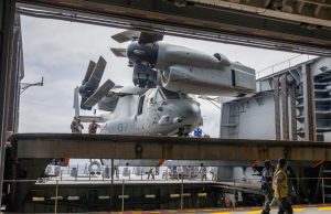 MV-22B Osprey moved off the flight deck into the hangar of HMAS Canberra
