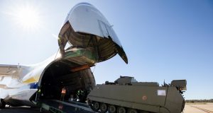 A M113AS4 Armoured Personnel Carrier bound for Ukraine is loaded onto an Antonov An-124 cargo aircraft at RAAF Base Amberley, Queensland.