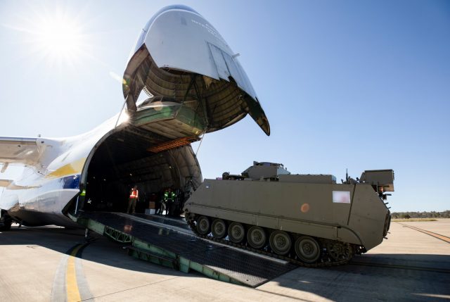 A M113AS4 Armoured Personnel Carrier bound for Ukraine is loaded onto an Antonov An-124 cargo aircraft at RAAF Base Amberley, Queensland.