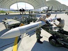US airmen install the wings and fins on an AIM-7 Sparrow missile at Hickam Air Force Base, Hawaii, during RIMPAC 2006
